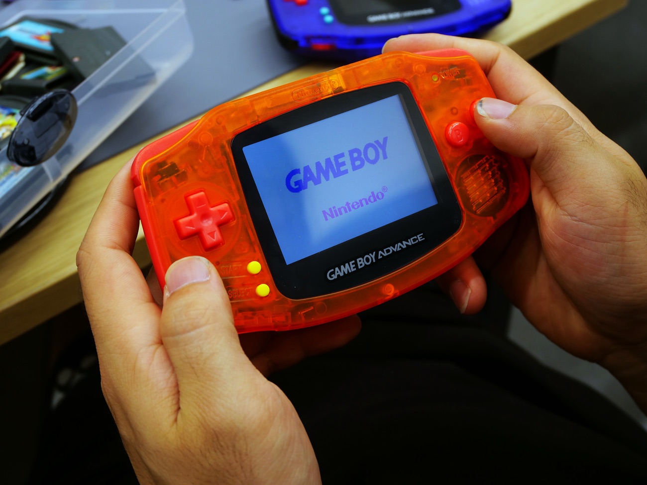 Custom clear-orange Game Boy Advance, screen lit