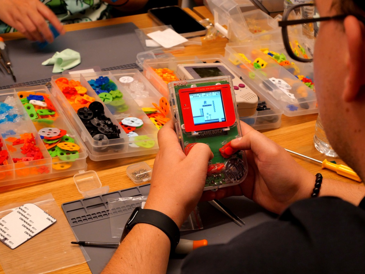 Crystal-clear Game Boy with colorful buttons
